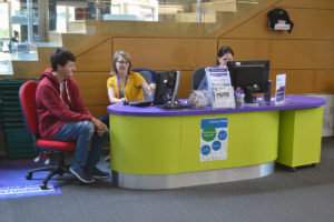 Client being served at Library Help Desk